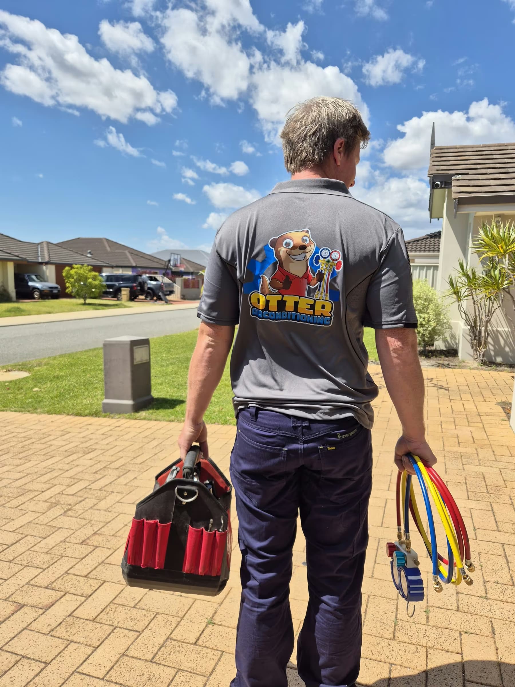 Matt from Otter Air arriving at a Perth home with tools and refrigerant gauges