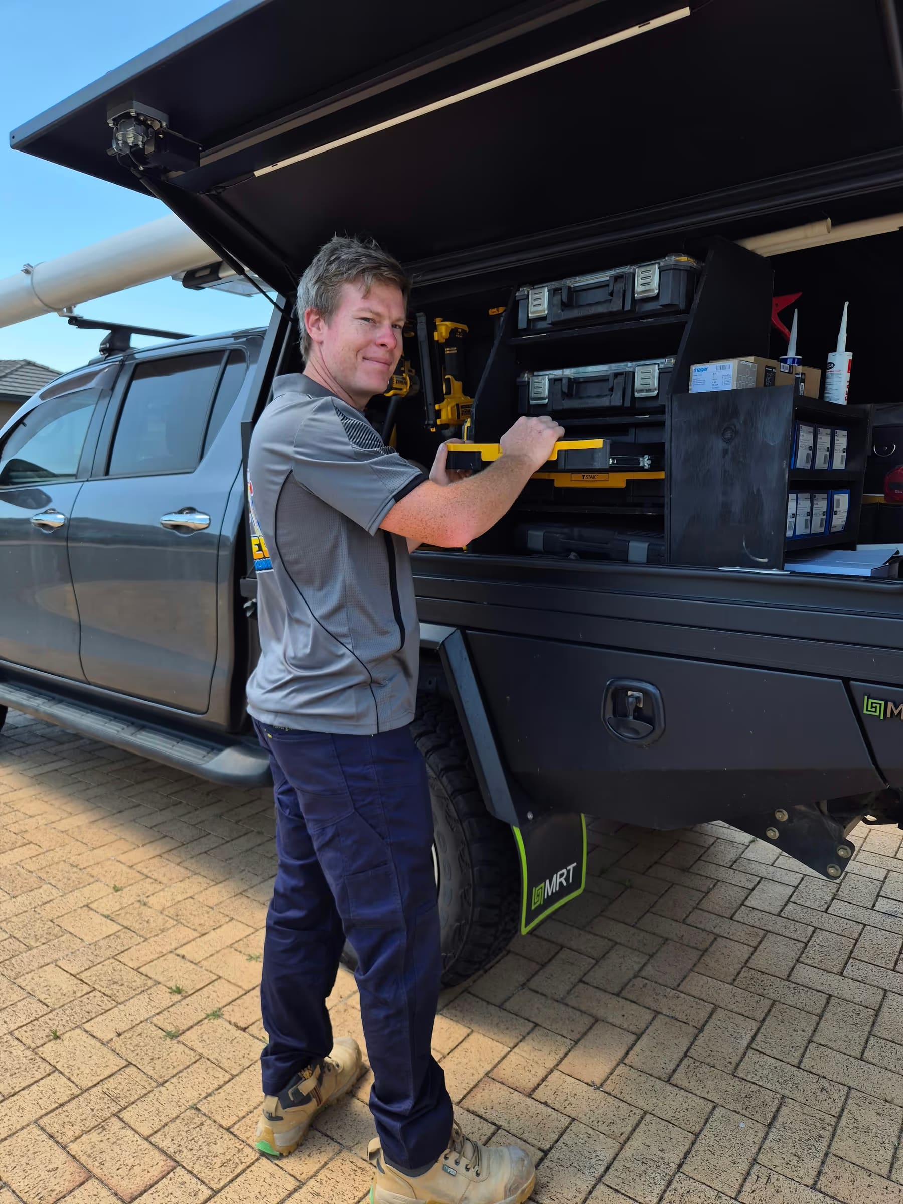 Otter Air technician at work truck